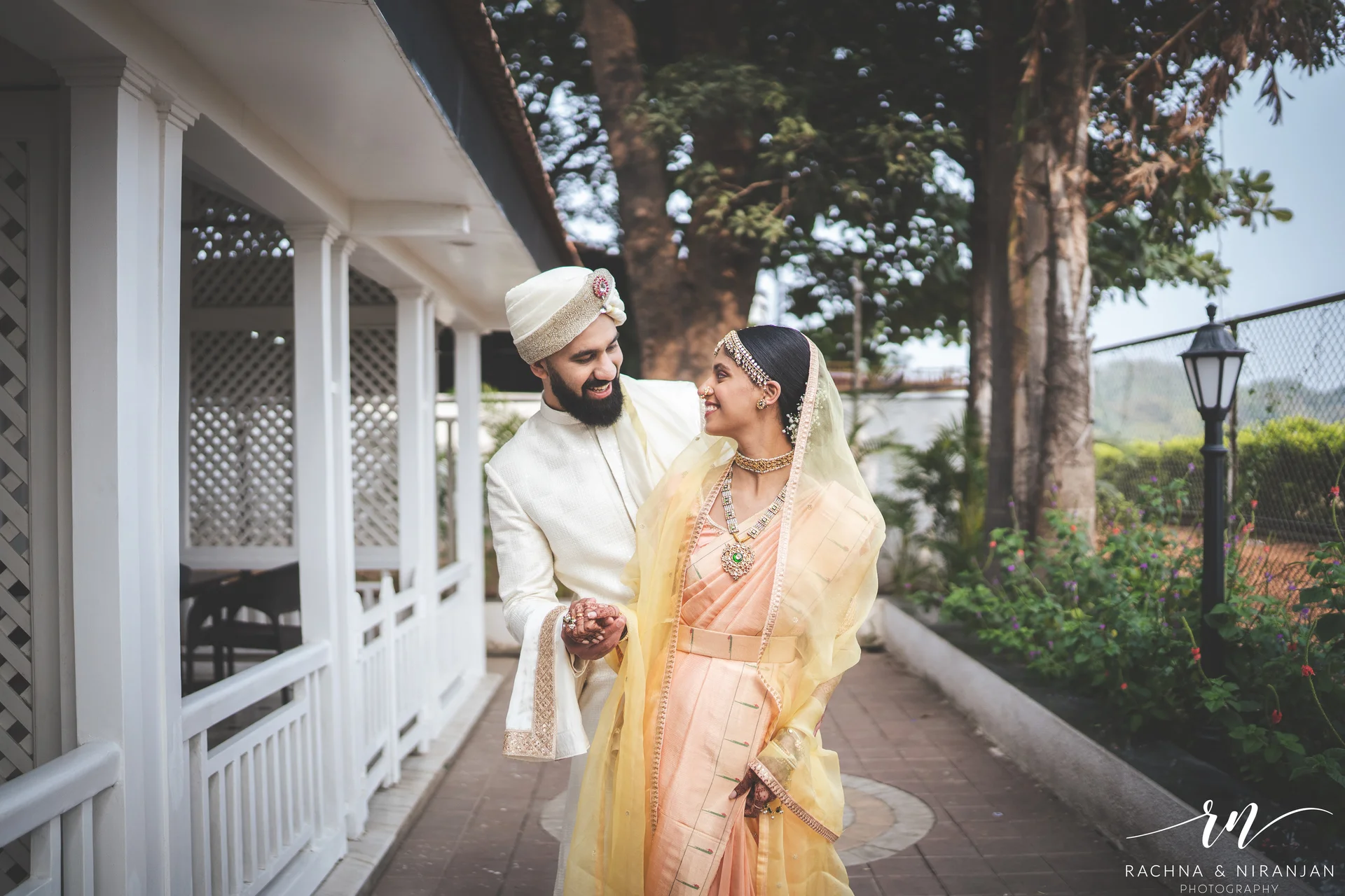 Romantic couple shoot of Ritika & Yash under dreamy wedding lights at Turf Club, Pune.