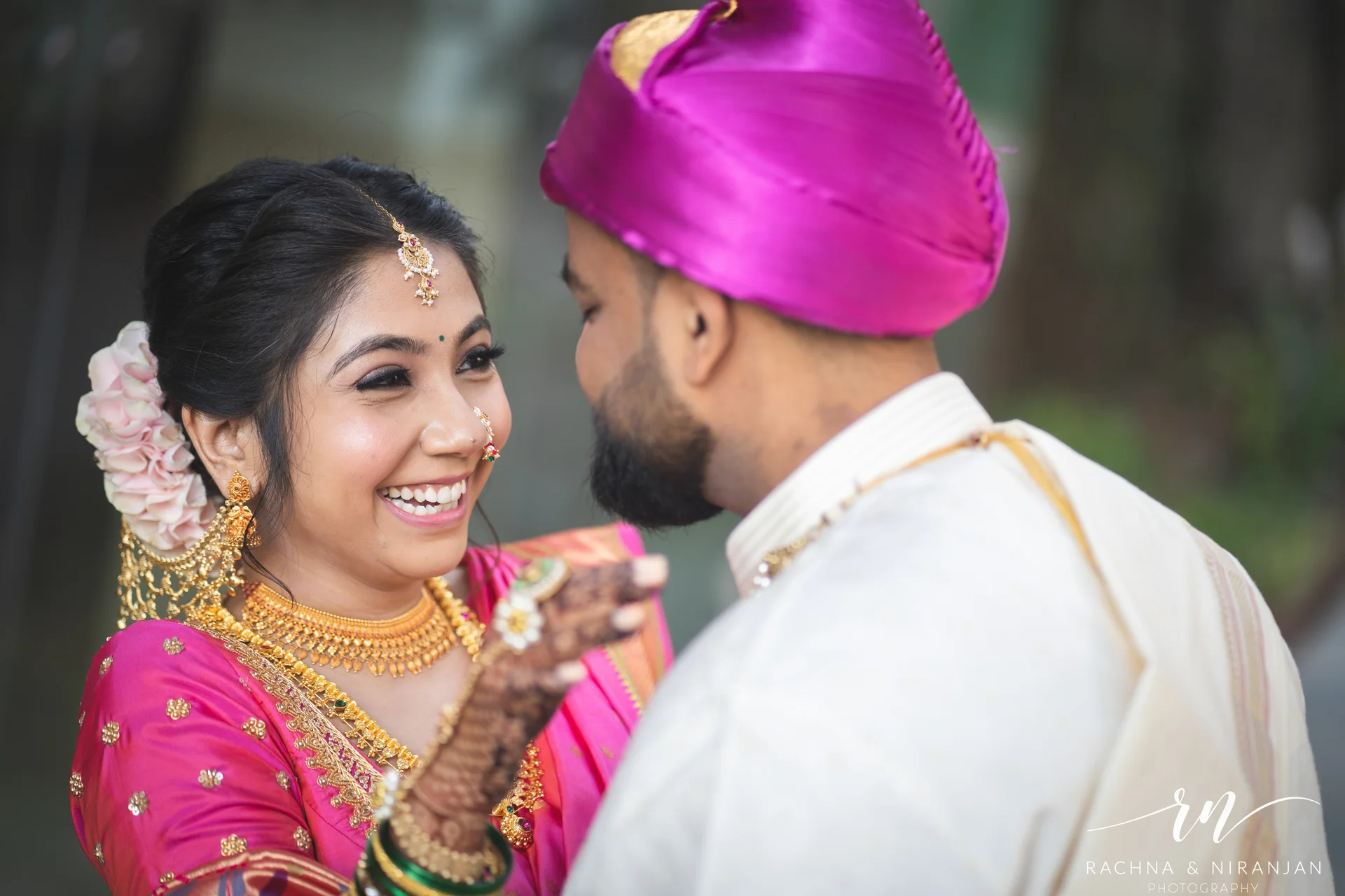 Close-up of a traditional red bridal lehenga worn by Sneha at her Gujarati wedding – a perfect shot by top Pune wedding photographers.