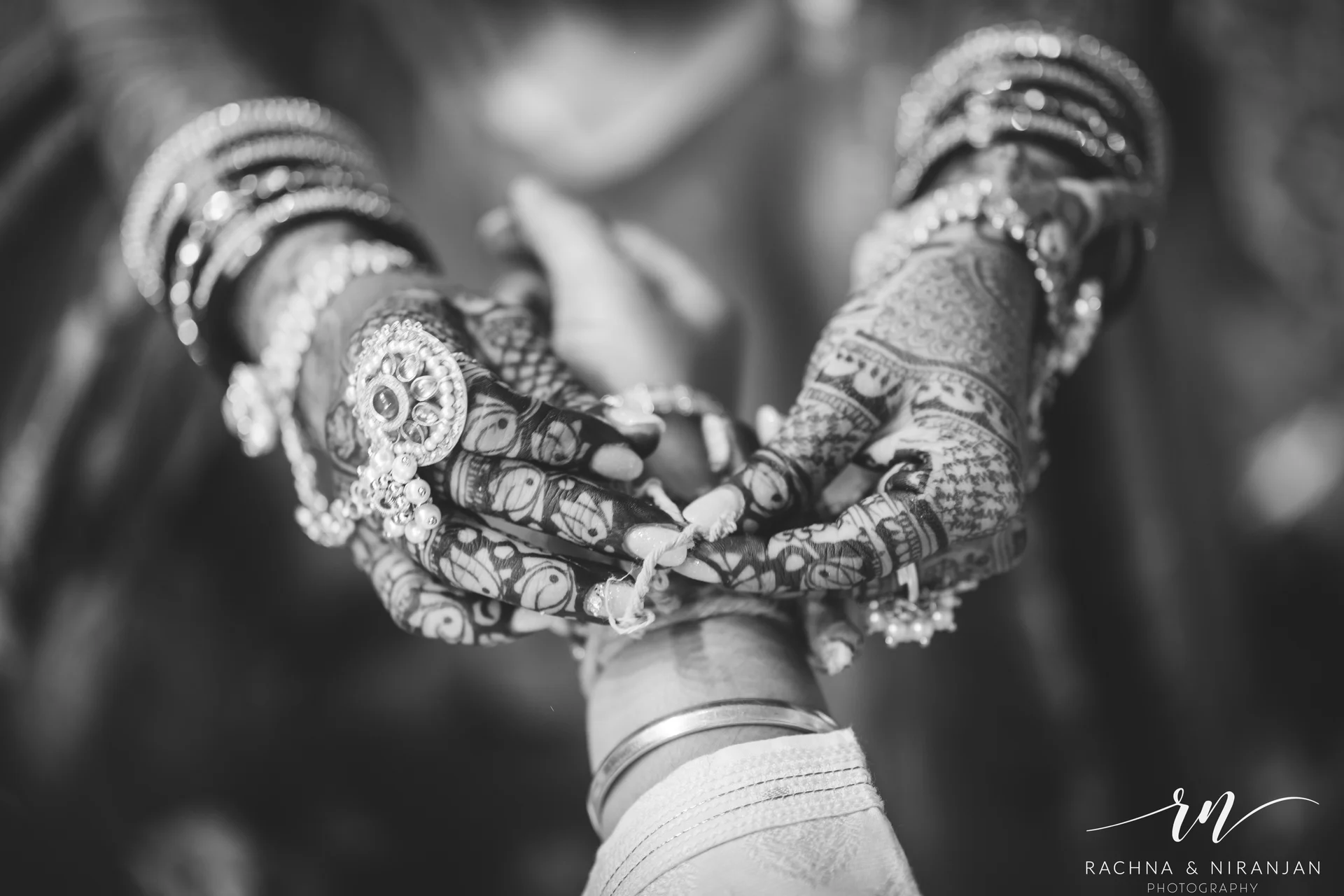 Candid moment of Sneha & Rahul exchanging a smile during their Gujarati wedding at Mayfield Estate, Pune – captured by top candid wedding photographers