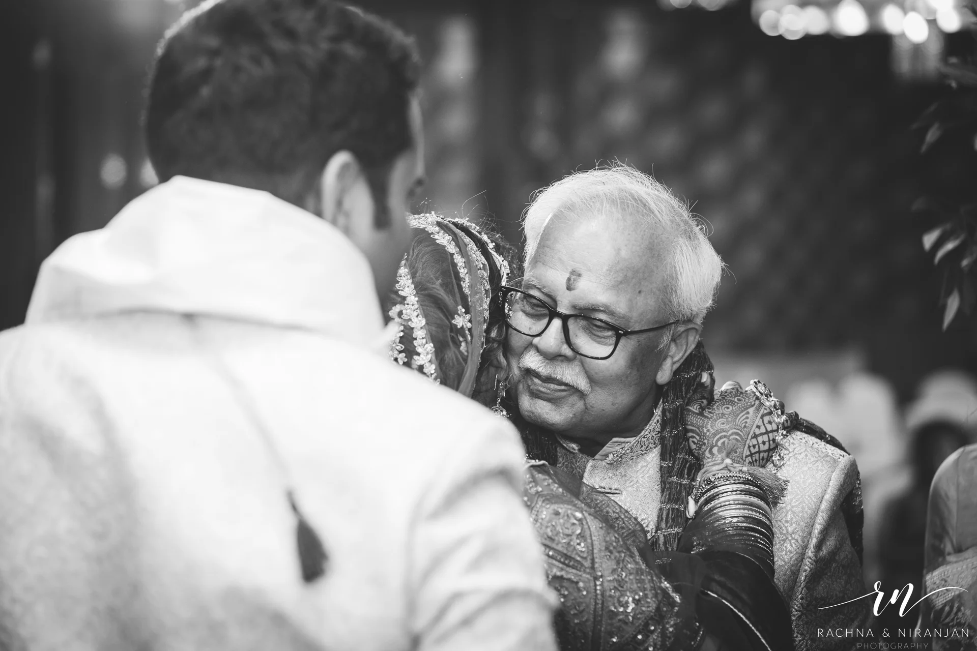 Bride Pratiksha sharing a warm hug with her fater