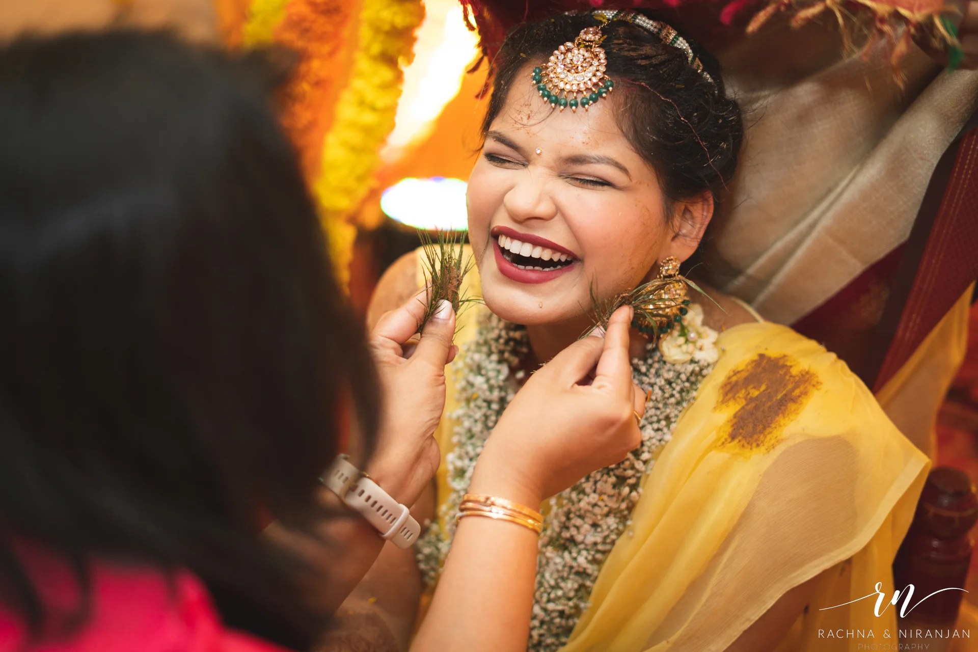 Vibrant Haldi photo of Pratiksha with floral jewellery, glowing with joy at her Bihari wedding in Pune