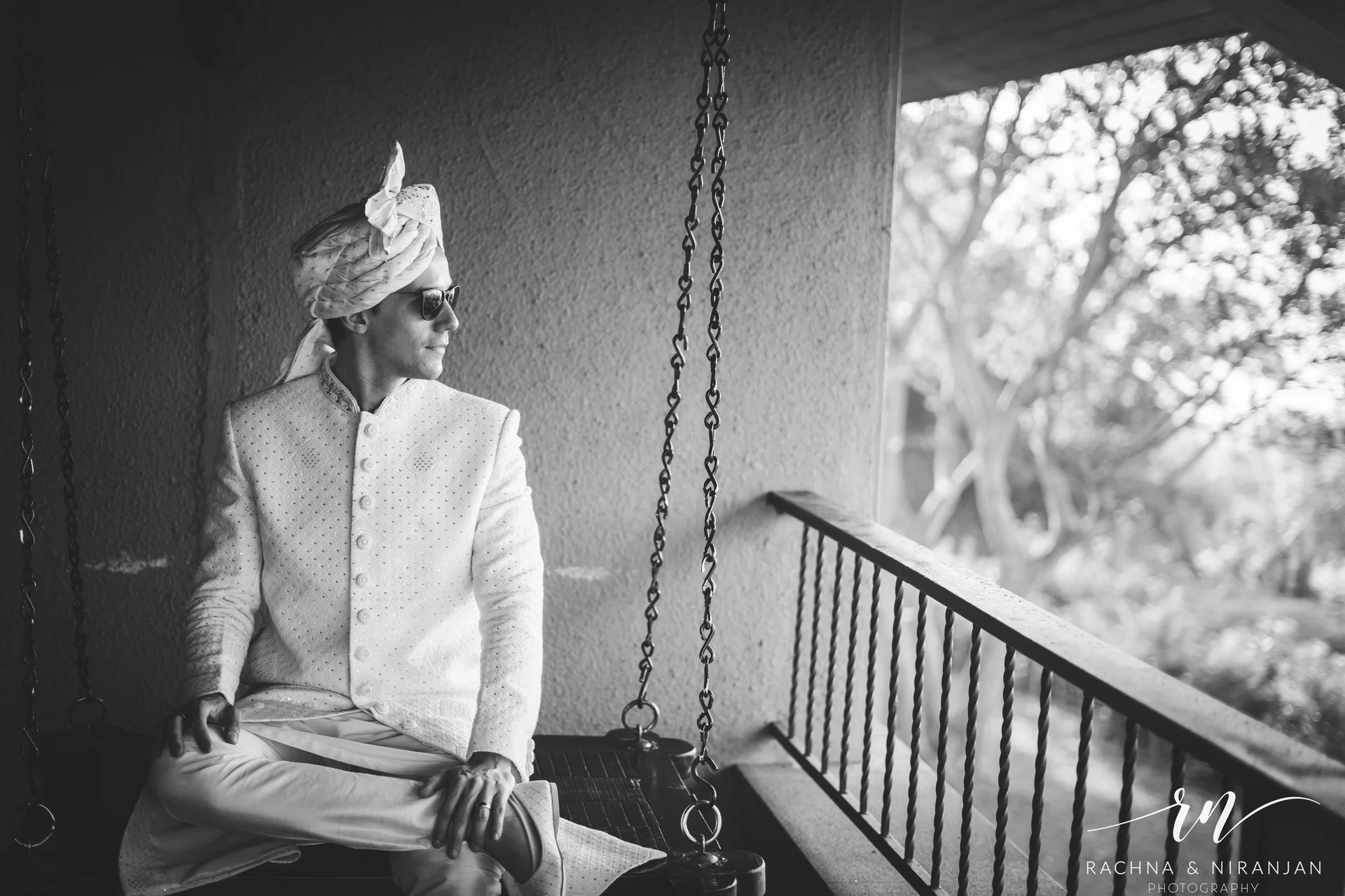 Black and White Capture of Danilo Smiling During Wedding Vows at Malhar Machi Mountain Resort