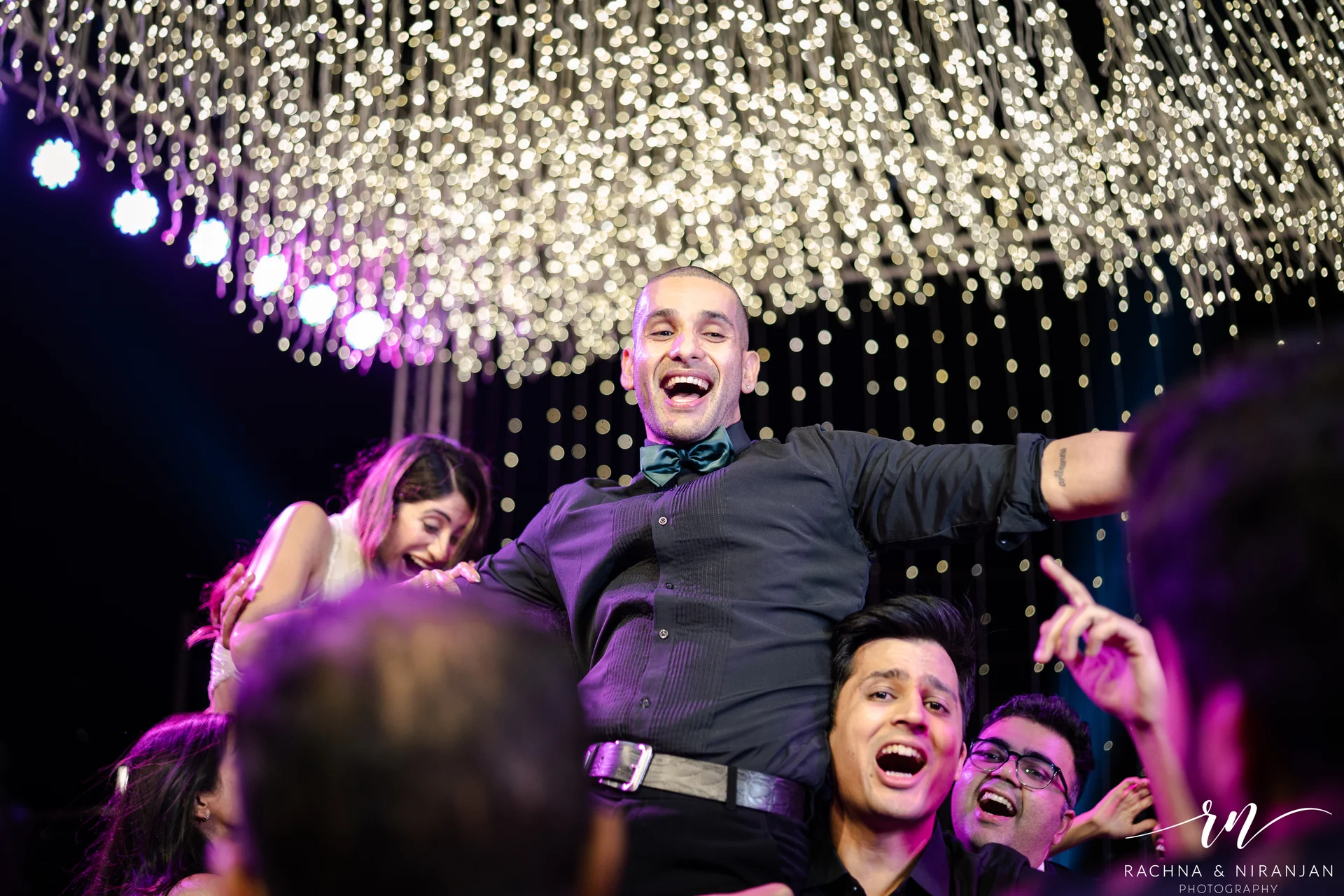 Friends and family dancing at destination wedding sangeet Panchgani