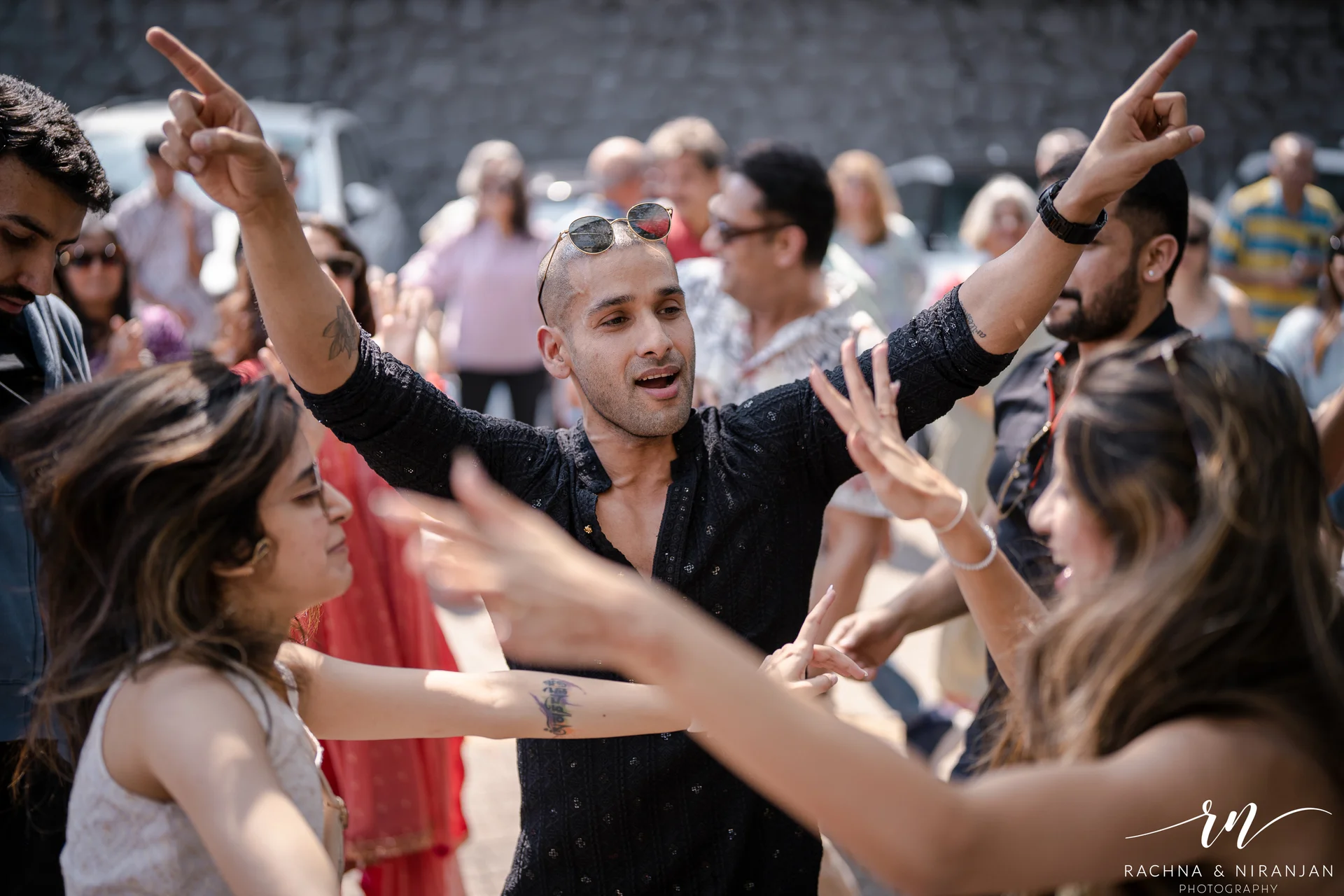 Friends and family dancing at destination wedding sangeet Panchgani