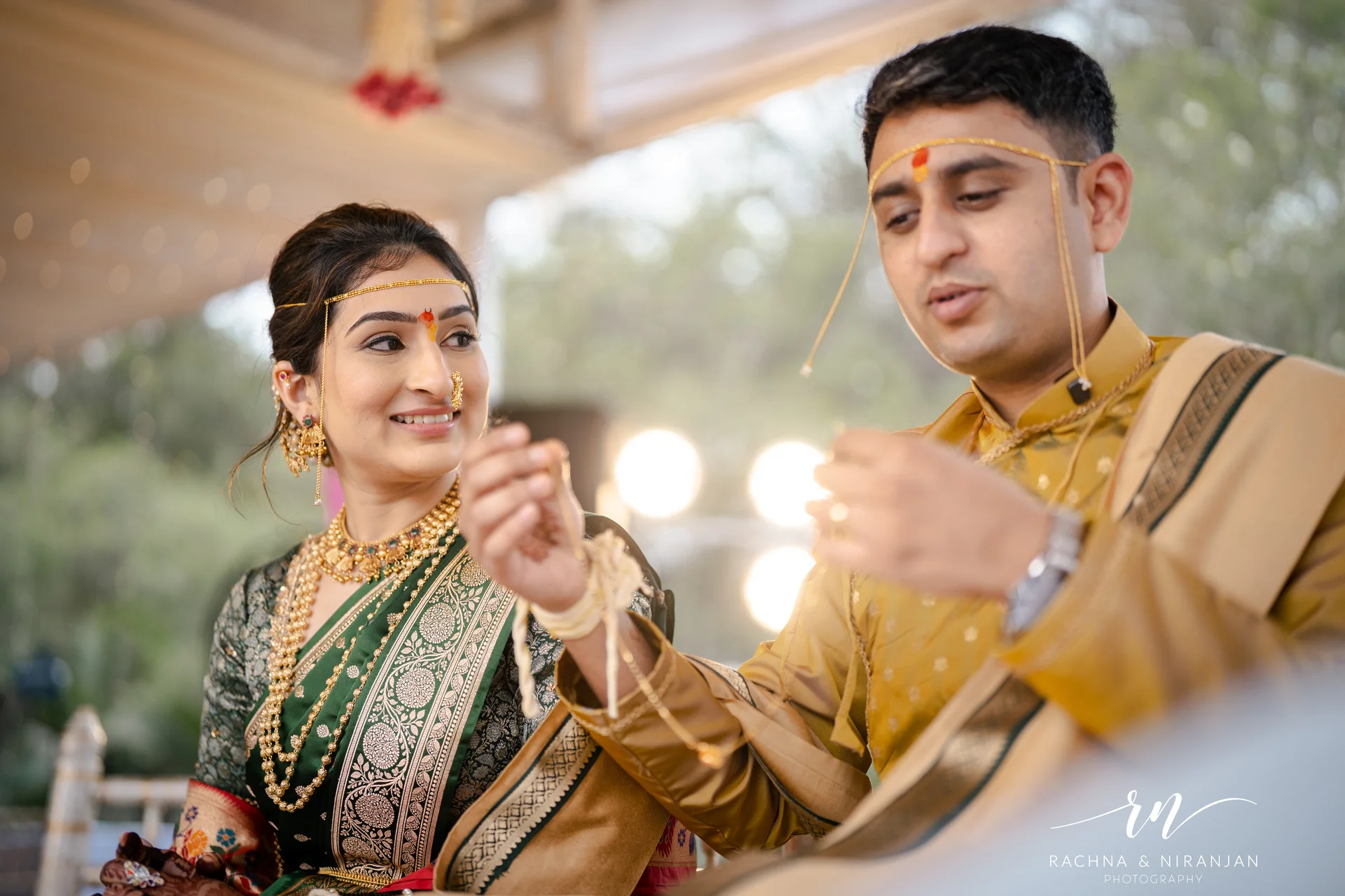 Bride and groom performing traditional Maharashtrian wedding rituals