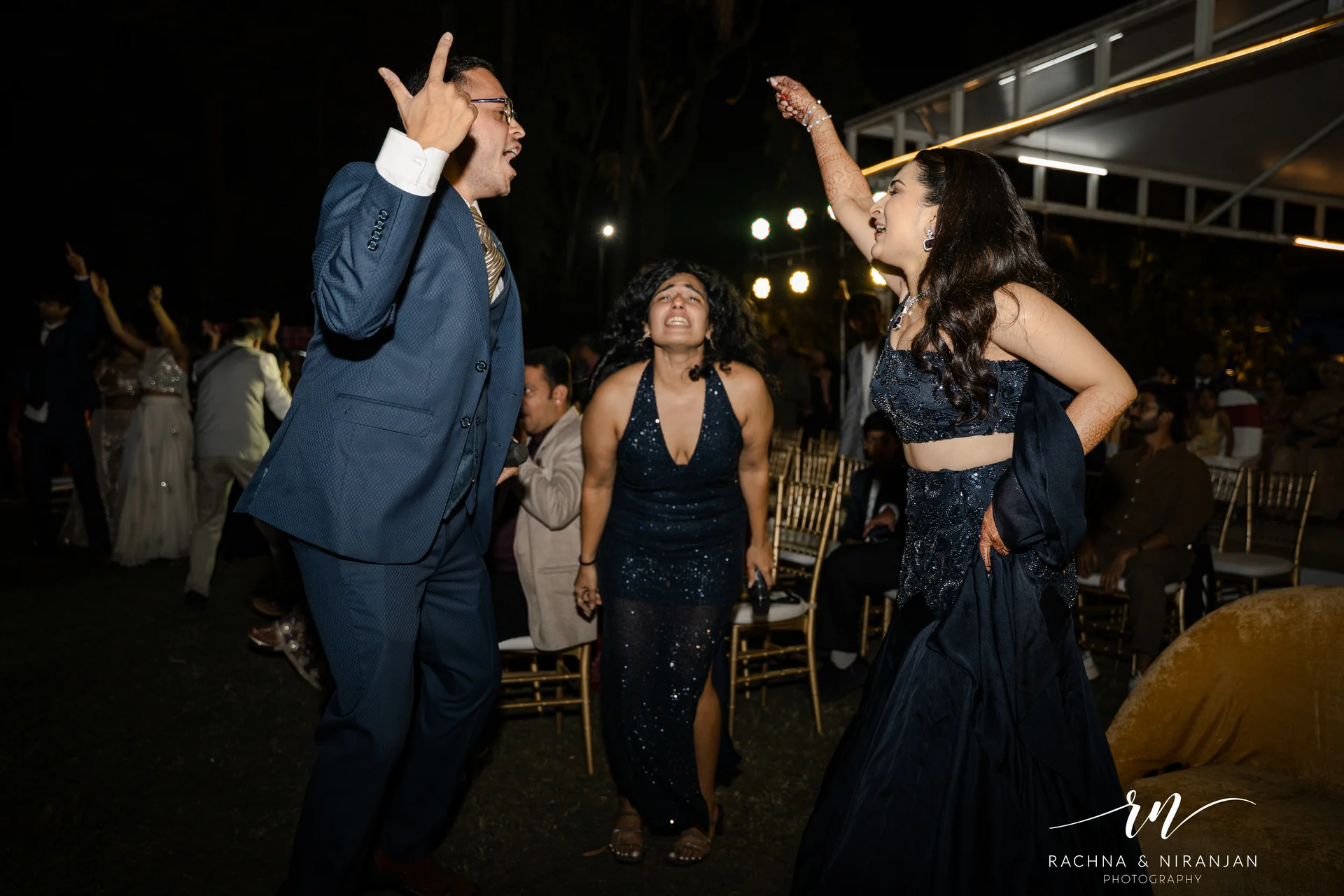 Friends dancing at wedding celebration photographed by Rachna Niranjan Photography