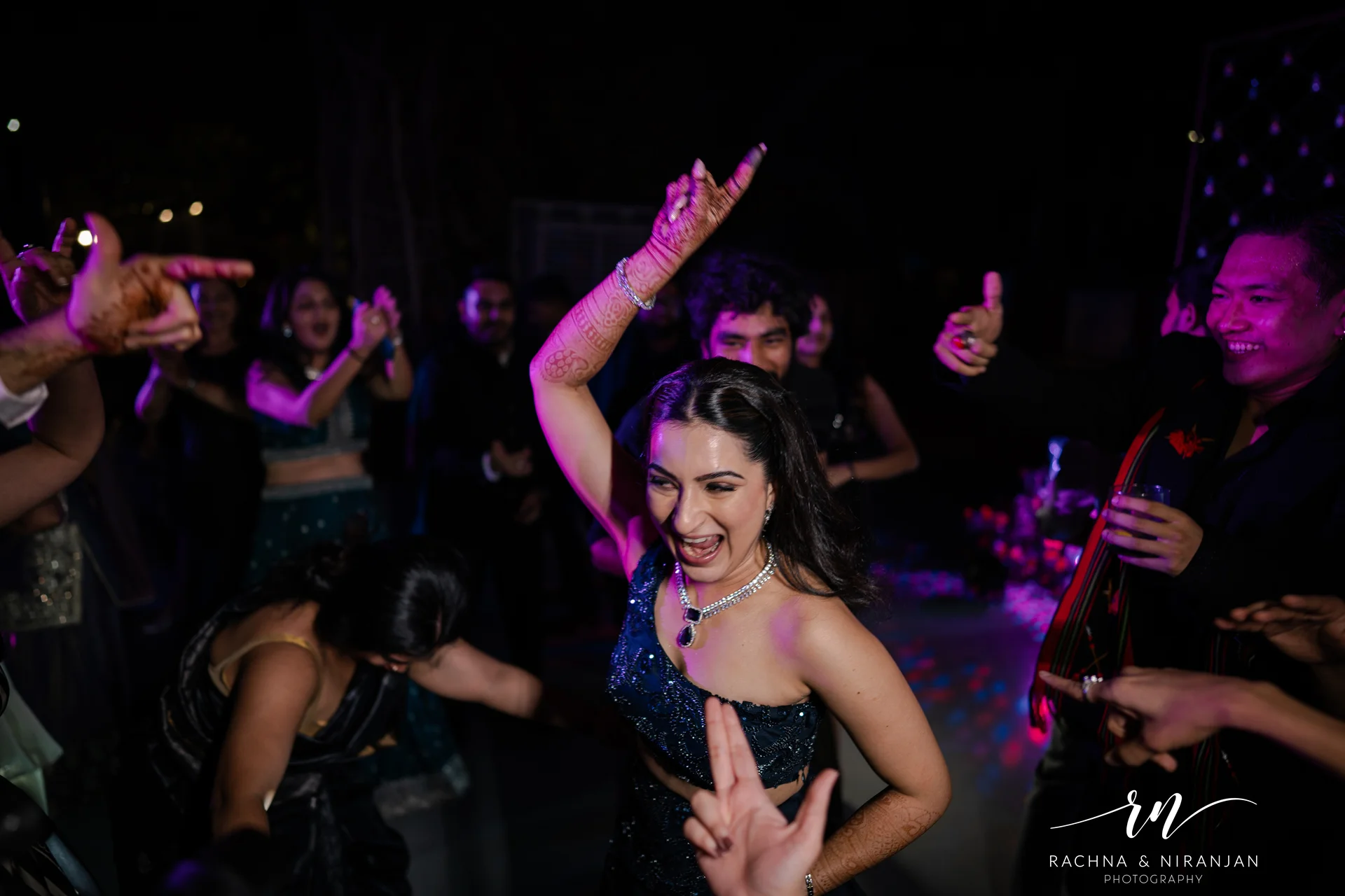 Groom dancing during wedding reception celebration by Rachna Niranjan Photography