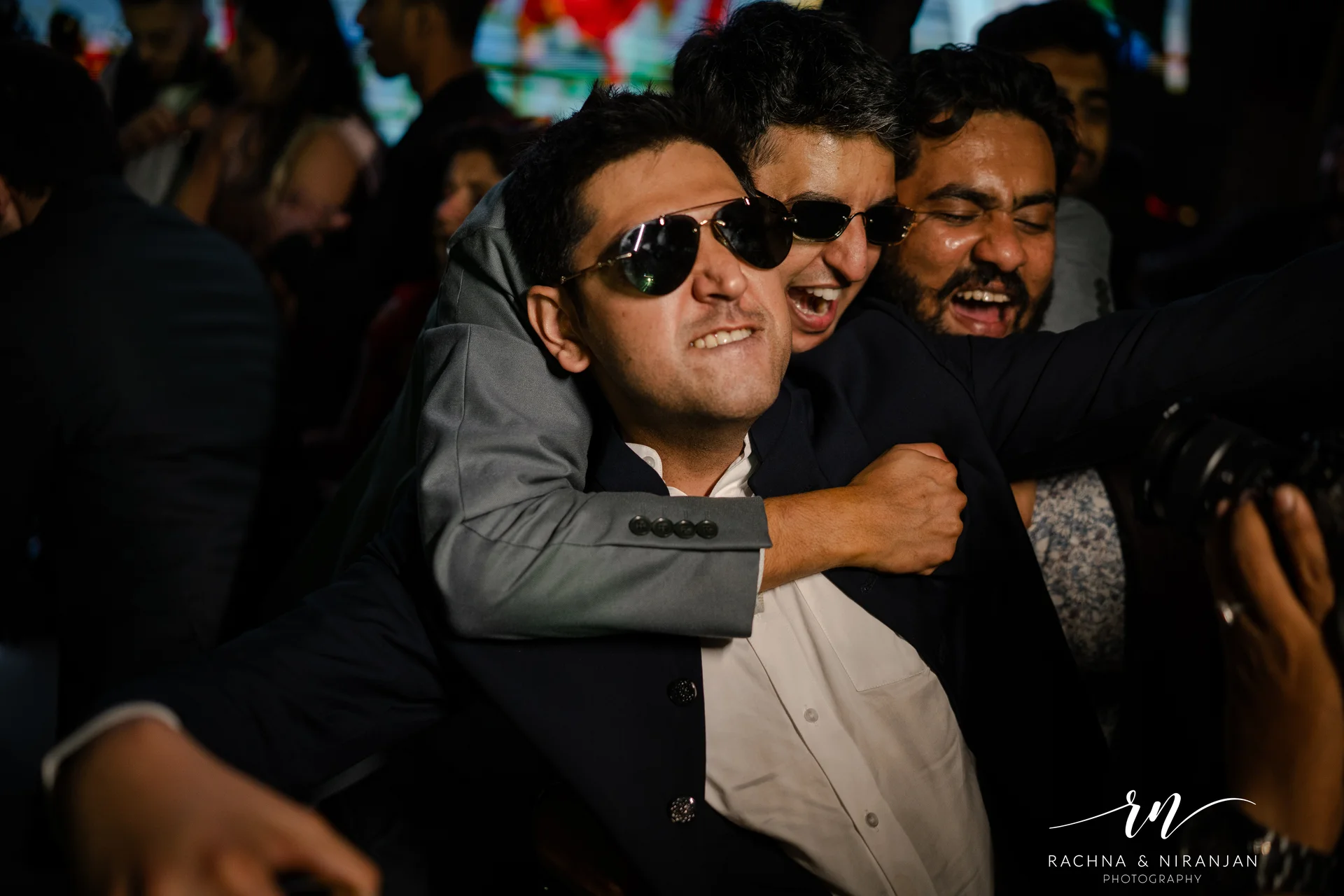Guests dancing joyfully at Maharashtrian wedding reception in Pune by Rachna Niranjan Photography 