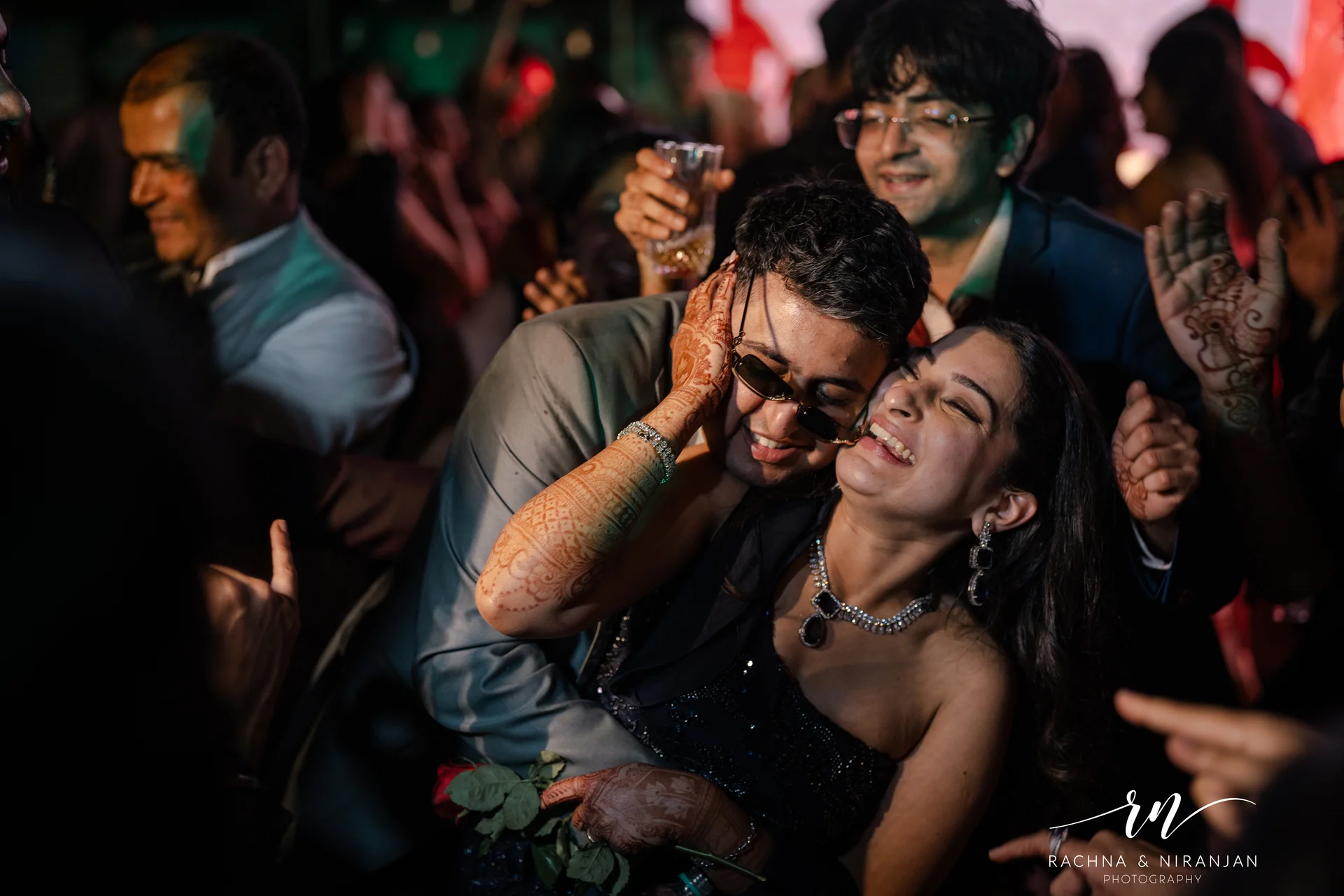 Guests dancing joyfully at Maharashtrian wedding reception in Pune by Rachna Niranjan Photography