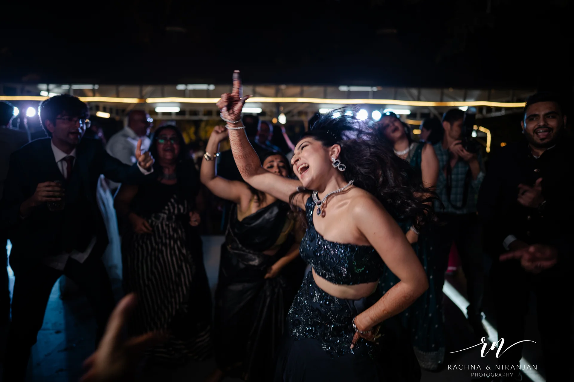 Wedding dance floor celebration at Sub Area Mess Pune captured by Rachna Niranjan Photography