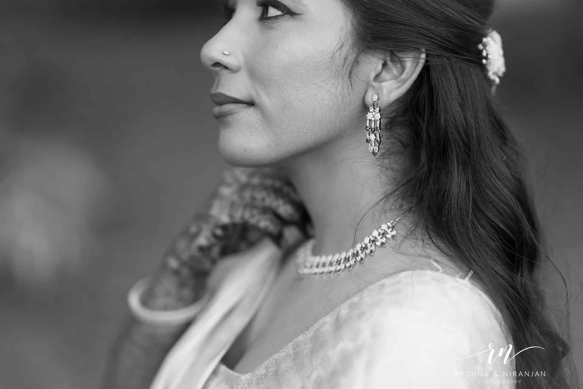 Bride laughing with family during Marathi wedding ritual