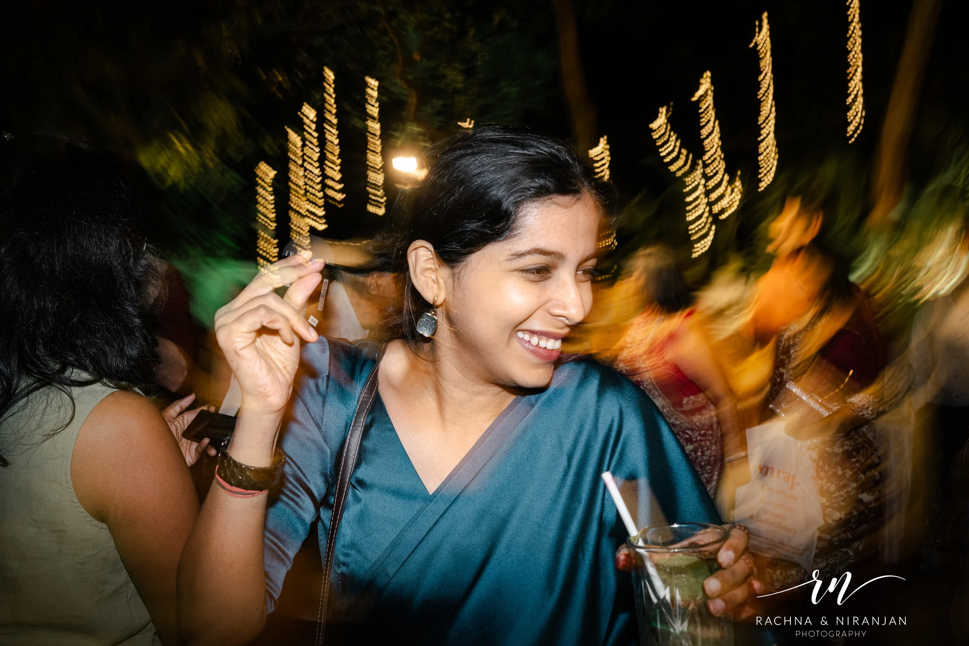 Bride twirling in saree with bokeh lights — best candid wedding photography Pune