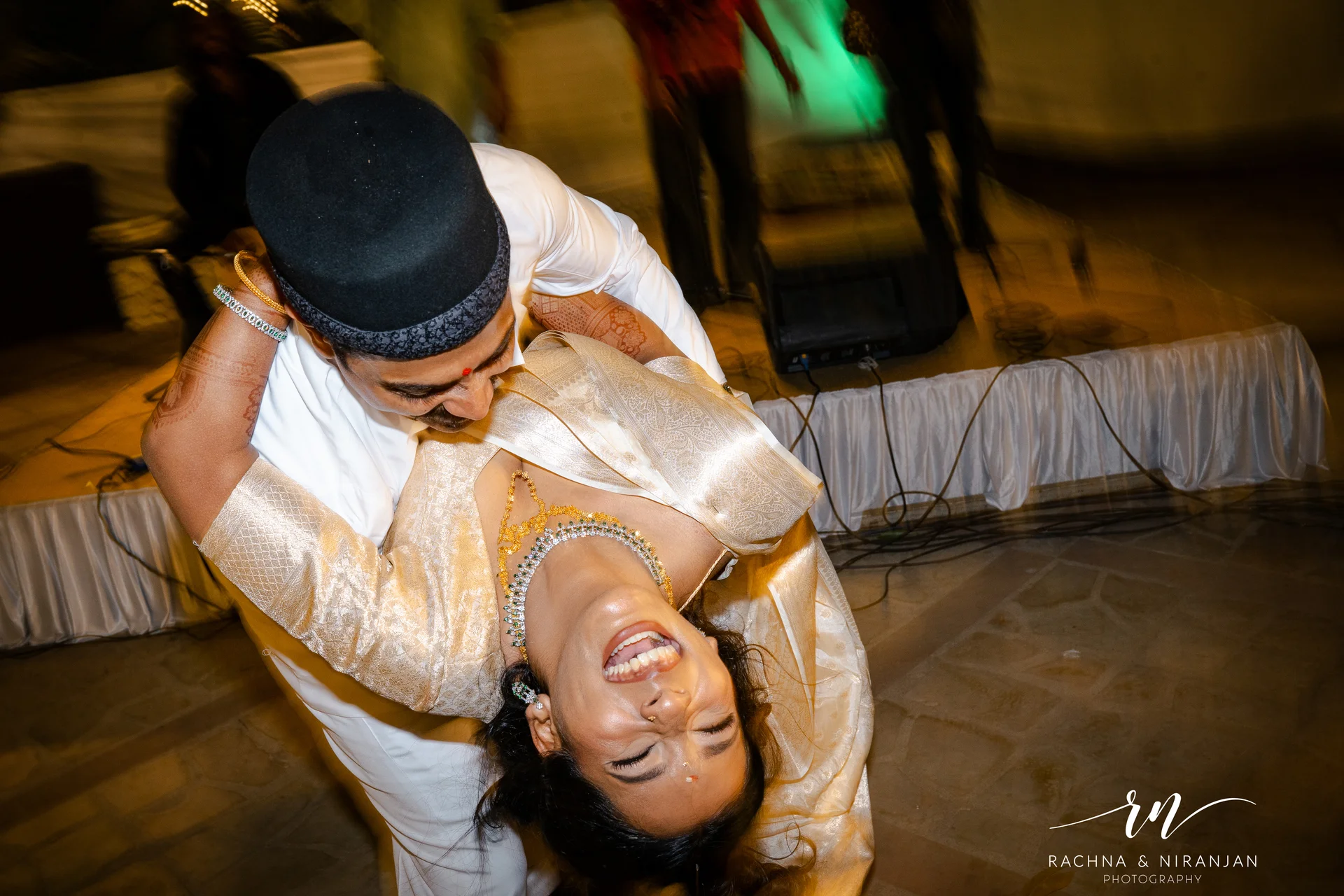 Couple dancing together at Marathi Parsi wedding reception - candid wedding photographer Pune