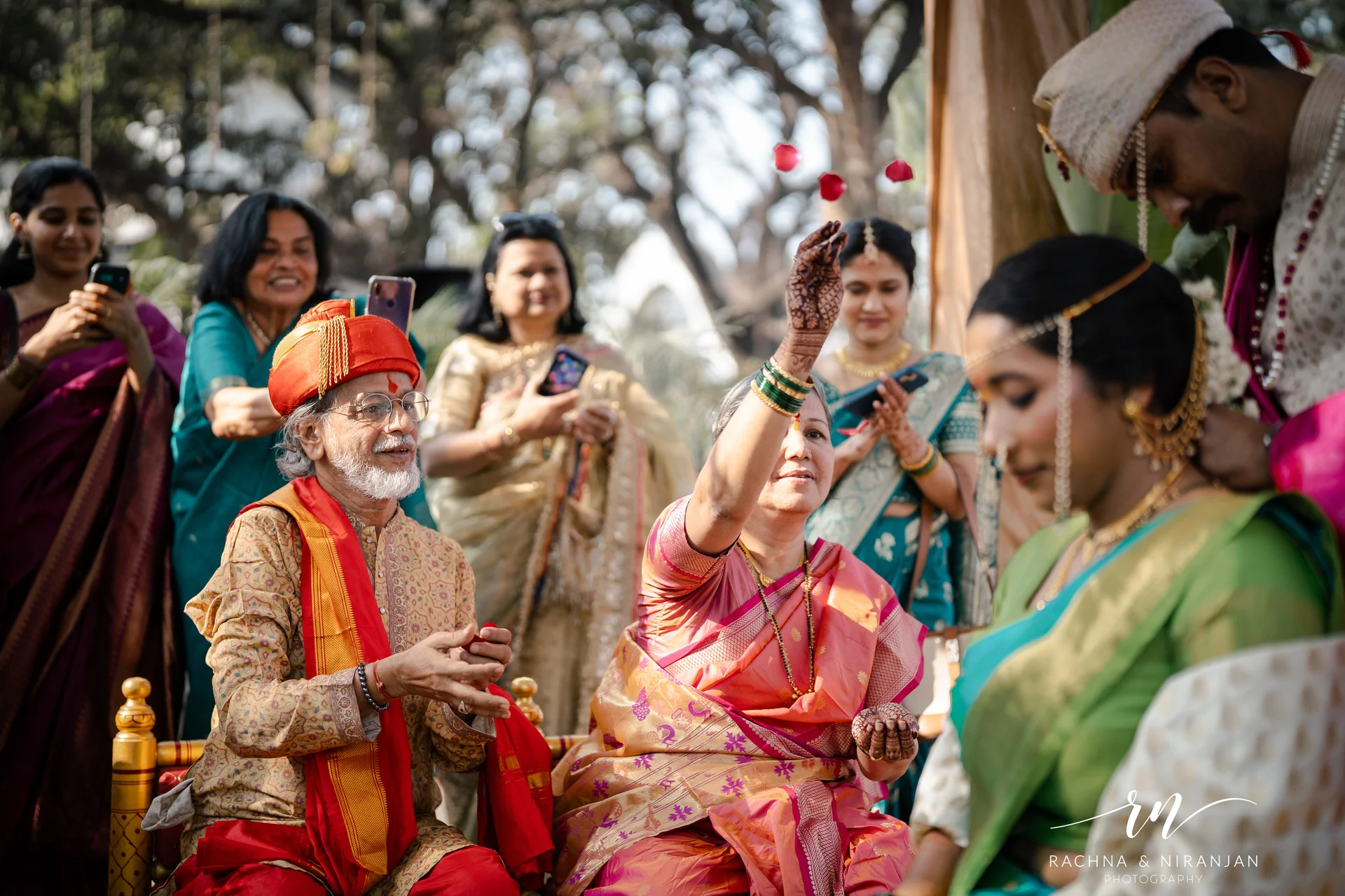 Family celebrating during outdoor Marathi wedding ritual — wedding photographer in Pune
