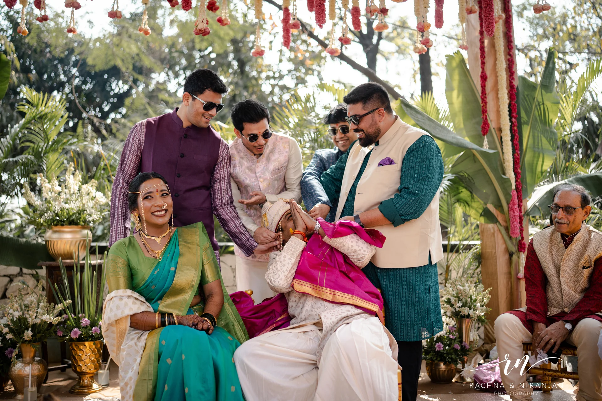 Guests capturing candid moments at Marathi Parsi wedding — candid wedding photography Pune