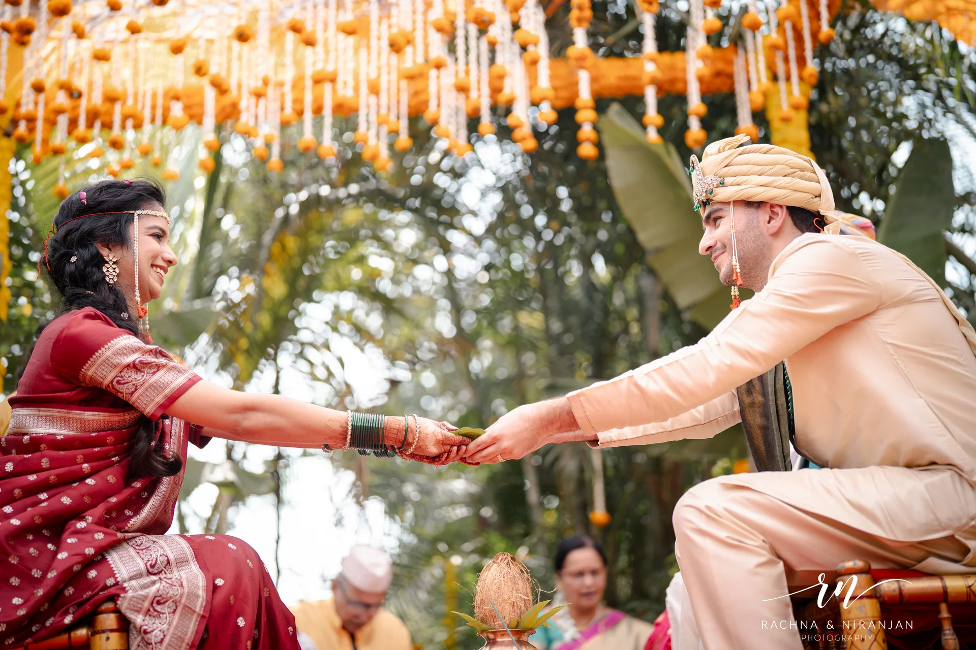 Bride and groom exchanging varmala
