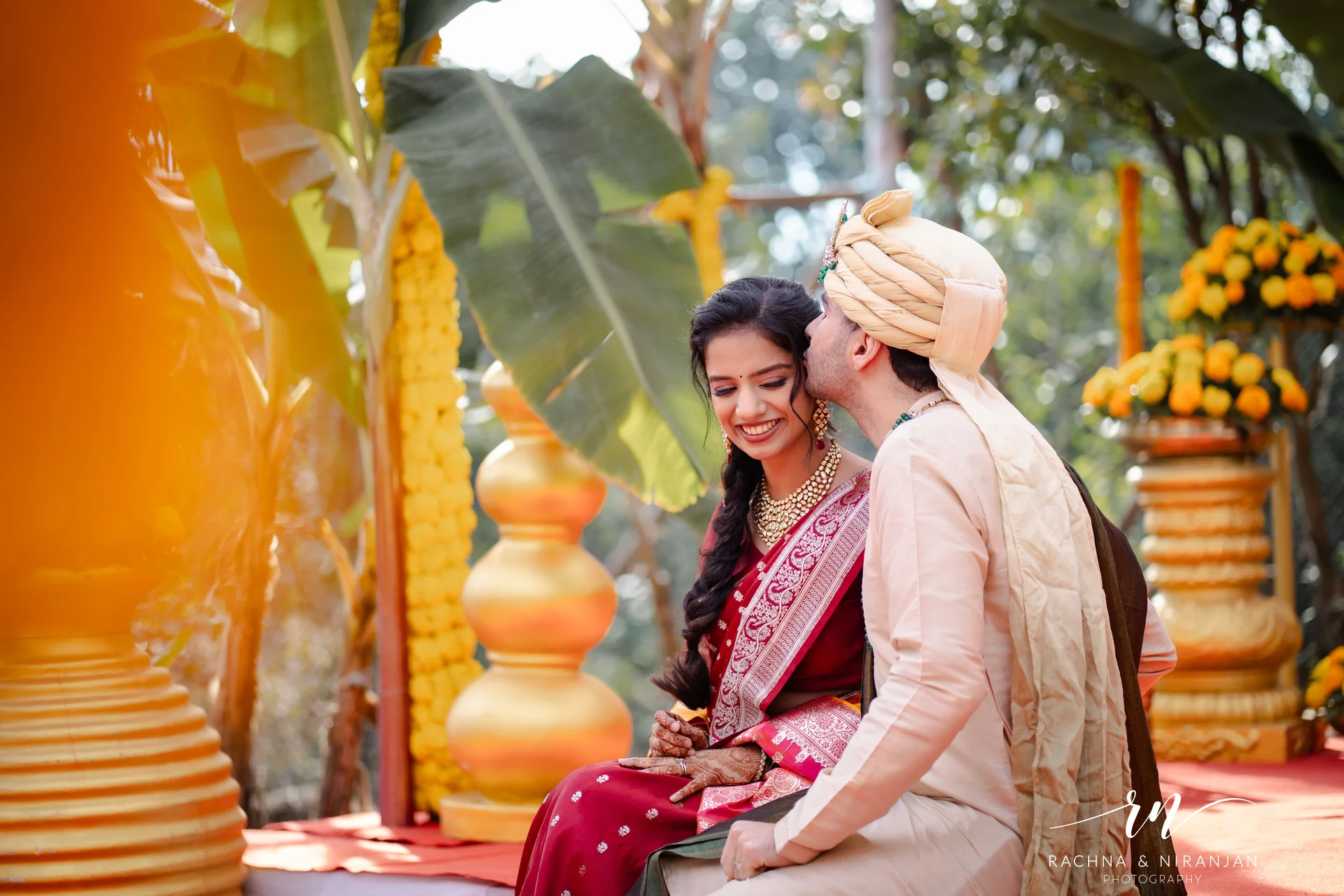 Bride and groom under wedding decor