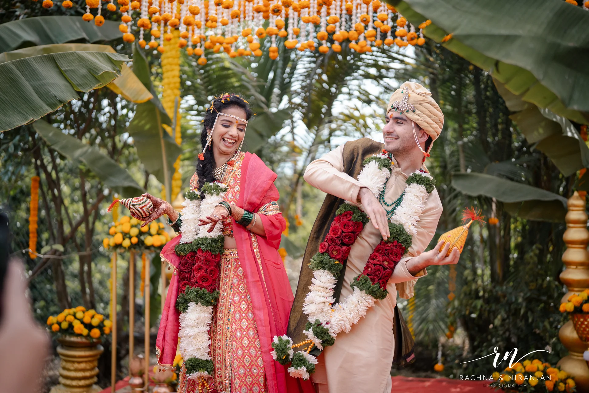 Joyful couple at farmhouse wedding ceremony